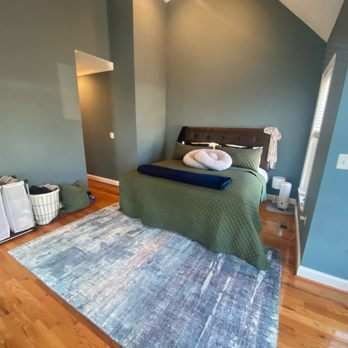 Bedroom with Green Walls and Rug
